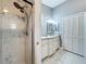 Bathroom with a glass shower, double sink vanity, gray walls, and closet at 216 Springside Rd, Longwood, FL 32779