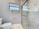 Bathroom featuring a clear glass-enclosed shower with tiled walls and floor at 216 Springside Rd, Longwood, FL 32779