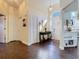 Welcoming foyer featuring hardwood floors, a console table, and views into the kitchen at 216 Springside Rd, Longwood, FL 32779