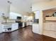 Bright kitchen with white cabinets and appliances adjacent to laundry room at 216 Springside Rd, Longwood, FL 32779