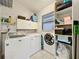 Efficient laundry room with shelving and storage at 216 Springside Rd, Longwood, FL 32779