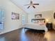 Bedroom features ceiling fan, hardwood floors, and natural light at 216 Springside Rd, Longwood, FL 32779