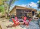 Back patio features a fire pit and screened-in porch for year-round enjoyment at 216 Springside Rd, Longwood, FL 32779