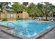 Community pool with lounge chairs and landscaped surroundings at 216 Springside Rd, Longwood, FL 32779