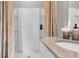 A clean shower with a white tiled surround and a modern shower head, enhancing the bathroom experience at 2801 Jamaica Way, Haines City, FL 33844