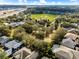 Aerial shot of a desirable neighborhood with mature trees and houses with screened patios at 2856 Park Meadow Dr, Apopka, FL 32703