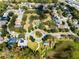 Aerial image of a well-manicured community park, surrounded by houses and mature trees at 2856 Park Meadow Dr, Apopka, FL 32703