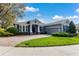 Lovely single-story home with black shutters, brick driveway and well-maintained landscaping at 2856 Park Meadow Dr, Apopka, FL 32703