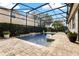 Relaxing backyard pool area within a screened enclosure, offering a private oasis at 2856 Park Meadow Dr, Apopka, FL 32703