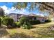 Expansive backyard featuring a screened-in patio, providing a tranquil outdoor space for relaxation and entertainment at 2856 Park Meadow Dr, Apopka, FL 32703