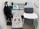 The photo displays assorted baby gear, including a stroller, playpen, bouncer, and highchair at 2904 Penelope Loop, Kissimmee, FL 34746