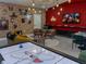 Finished basement with a Harry Potter theme, featuring an air hockey table and entertainment area at 2904 Penelope Loop, Kissimmee, FL 34746