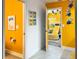 Fun bathroom design with bright yellow walls and 'Minions' themed decor at 2904 Penelope Loop, Kissimmee, FL 34746