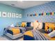 Bright bedroom with 'Toy Story' wall decor and two neatly made twin beds, perfect for children at 2904 Penelope Loop, Kissimmee, FL 34746