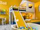 room features a bunk bed with a slide, a ball pit, and bright yellow accents at 2904 Penelope Loop, Kissimmee, FL 34746