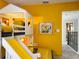 room featuring a bunk bed, a slide, and 'Minions' themed wall art at 2904 Penelope Loop, Kissimmee, FL 34746