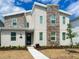 Modern home with stone accents, landscaped front yard, and a welcoming entrance at 2904 Penelope Loop, Kissimmee, FL 34746