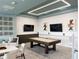 Bright game room featuring a pool table, stylish decor, and a modern lighting fixture for leisure and entertainment at 2904 Penelope Loop, Kissimmee, FL 34746