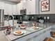 Modern kitchen featuring a gray countertop with Mickey Mouse themed accents, and a sink at 2904 Penelope Loop, Kissimmee, FL 34746