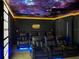 Home theater with starlight ceiling, movie projector, and reclining chairs for the ultimate viewing experience at 2904 Penelope Loop, Kissimmee, FL 34746