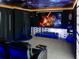 Home theatre featuring Star Wars theming, projector, screen, and reclining seats at 2904 Penelope Loop, Kissimmee, FL 34746