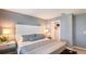 Calming bedroom with neutral grey walls, plush bed, and walk-in closet at 3587 Davenport Creek Ct, Kissimmee, FL 34746