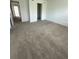 A spacious bedroom with neutral carpet, a closet, and a hallway visible at 3587 Davenport Creek Ct, Kissimmee, FL 34746