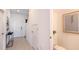 Clean, bright hallway with tile flooring and neutral decor; half-bathroom access at 3587 Davenport Creek Ct, Kissimmee, FL 34746