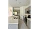 Kitchen featuring a kitchen island, gray cabinetry and stainless steel appliances at 3587 Davenport Creek Ct, Kissimmee, FL 34746