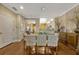 Dining room with a modern chandelier adjacent to the kitchen at 3909 Messina Dr, Lake Mary, FL 32746