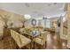 Elegant dining area with a large chandelier and modern decor at 3909 Messina Dr, Lake Mary, FL 32746