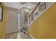 Bright foyer with staircase and tile flooring, leading into the home at 3909 Messina Dr, Lake Mary, FL 32746