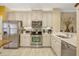 Bright kitchen featuring stainless steel appliances, subway tile backsplash, and white cabinets at 3909 Messina Dr, Lake Mary, FL 32746