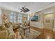 Open concept living room featuring hardwood floors, neutral tones, shuttered windows, and modern decor at 3909 Messina Dr, Lake Mary, FL 32746