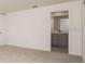 Bedroom leading into on-suite bathroom with neutral color scheme at 41 Redwood Ct, Kissimmee, FL 34759