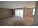 Large living room featuring access to a balcony at 4109 Dijon Dr # 4109H, Orlando, FL 32808