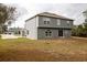 A wide view of the spacious backyard and exterior of the home at 4191 Sw 110Th Ln, Ocala, FL 34476