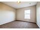 This cozy bedroom features neutral walls, carpeted floors, and a bright window at 4191 Sw 110Th Ln, Ocala, FL 34476