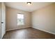 Bedroom featuring laminate floors, neutral walls, and a window view at 4191 Sw 110Th Ln, Ocala, FL 34476