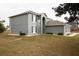 Two-story house featuring modern colors and a well-maintained lawn at 4191 Sw 110Th Ln, Ocala, FL 34476