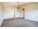 Spacious living room featuring carpet and multiple hallways at 4191 Sw 110Th Ln, Ocala, FL 34476