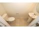 Cozy powder room featuring a pedestal sink and a toilet at 4653 Sparkling Shell Ave, Kissimmee, FL 34746