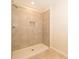 Tiled shower with shower head and built-in niche at 4653 Sparkling Shell Ave, Kissimmee, FL 34746