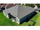 Aerial view of the home showcasing its roof, screened-in patio, and green surroundings at 472 Huntington Pines Dr, Ocoee, FL 34761