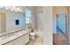 Bright bathroom features a shower over tub and granite vanity at 472 Huntington Pines Dr, Ocoee, FL 34761