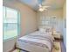 Bright bedroom with white furniture, a window, and playful decor at 472 Huntington Pines Dr, Ocoee, FL 34761