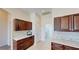 Kitchen area features dark cabinets, granite countertops, and tile backsplash at 472 Huntington Pines Dr, Ocoee, FL 34761