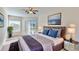 Serene main bedroom with plush bedding, ample natural light, and stylish decor at 472 Huntington Pines Dr, Ocoee, FL 34761