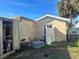 Backyard view of a home needing maintenance and showing neglected yard space at 491 Grandview Ave, Ormond Beach, FL 32176