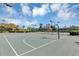 Outdoor basketball court surrounded by a fence and landscaping, ideal for recreation and community activities at 515 Mickleton Loop, Ocoee, FL 34761